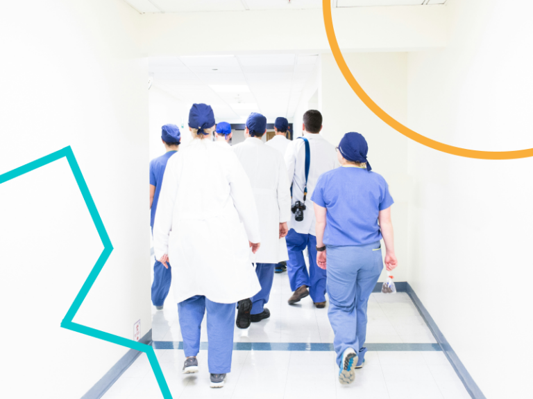 A photo of healthcare professionals walking down a corridor